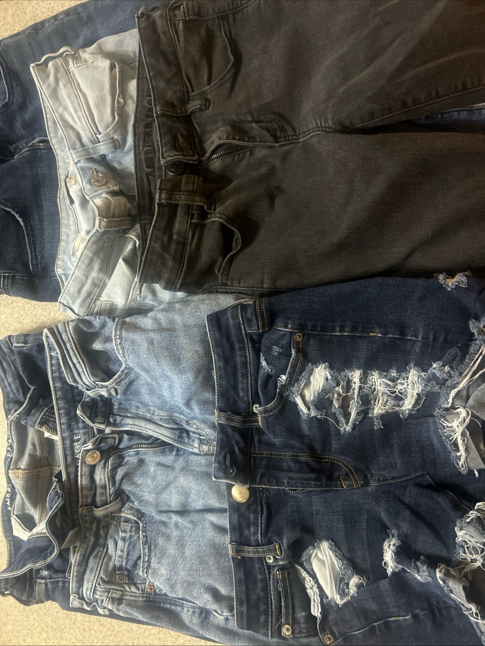 (5) Pair American Eagle jeans size 4. Used. Also 1 Pair Of Denim Shorts Used